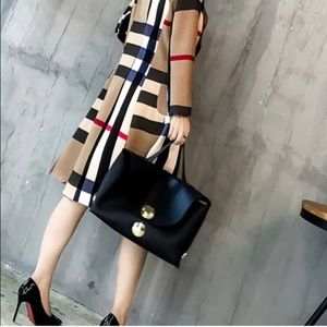 Brand New with Tags Burberry Print Trench Coat. Very stylish!!